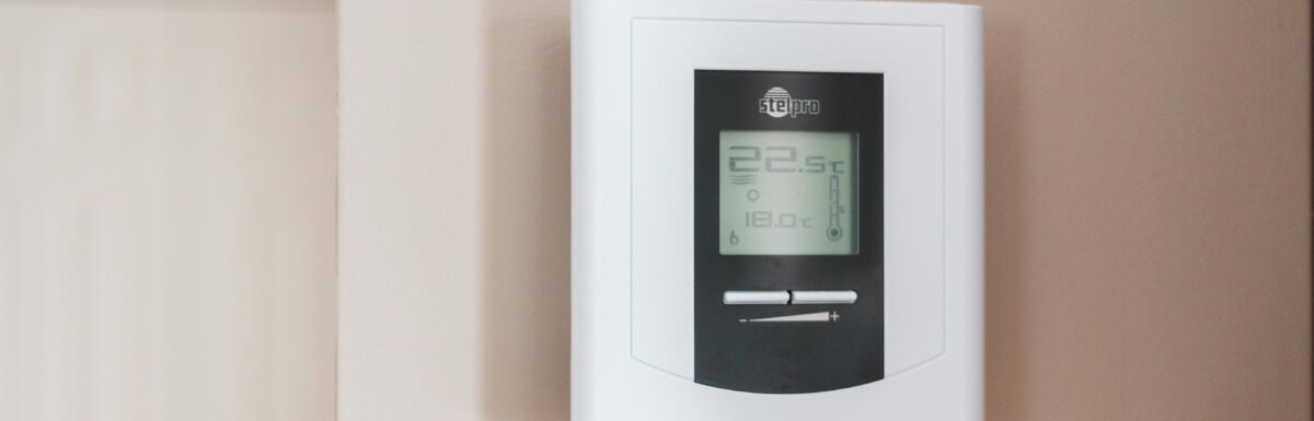 Photo by Erik Mclean: https://www.pexels.com/photo/white-thermostat-hanging-on-the-wall-7616651/